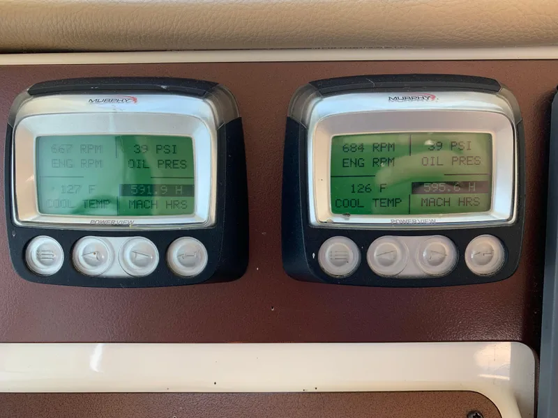 Slide: The Image of Digital engine displays on a 2012 Silverton 33 Sport Coupe showing RPM, oil pressure, and temperature. - 31