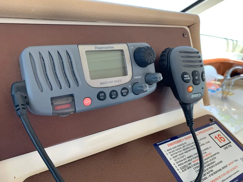 Slide: The Image of VHF radio system on 2012 Silverton 33 Sport Coupe boat dashboard. - 33