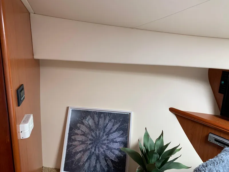 Slide: The Image of Interior of 2012 Silverton 33 Sport Coupe with artwork and plant decor. - 38