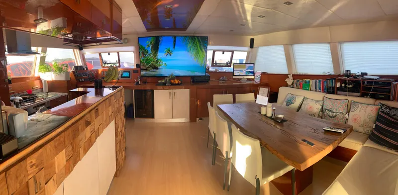 Slide: The Image of Luxurious interior of 2011 Sunreef 62 yacht with modern kitchen and dining area. - 13