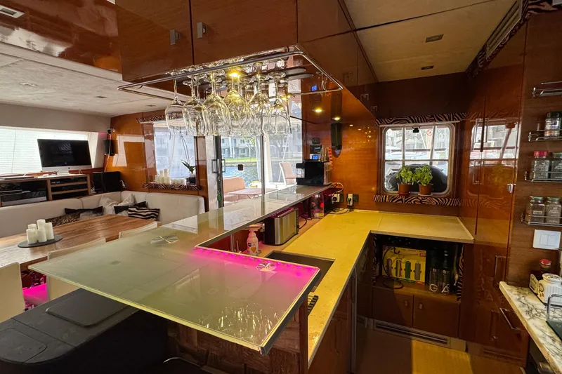 Slide: The Image of Luxurious interior of a 2011 Sunreef 62 yacht with modern kitchen and lounge area. - 18