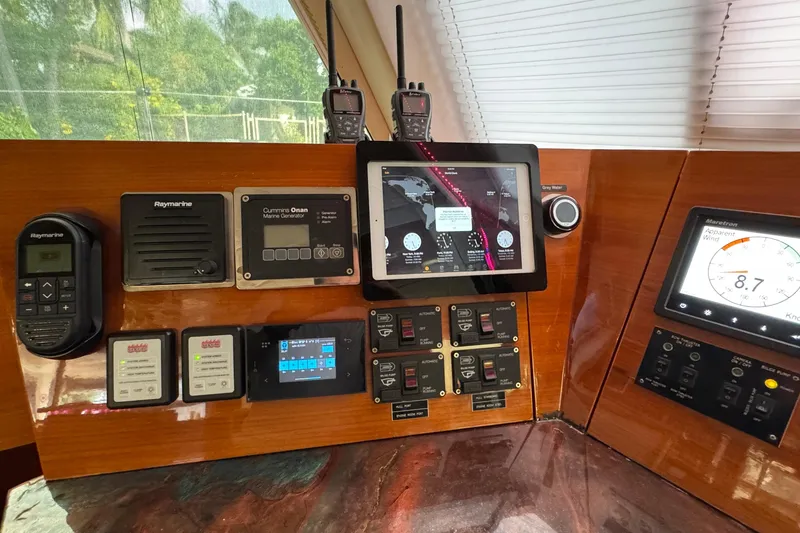 Slide: The Image of Control panel of a 2011 Sunreef 62 yacht with navigation and communication equipment. - 23