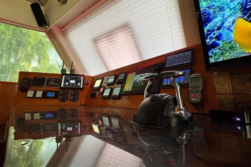 Slide: The Image of Control panel of a 2011 Sunreef 62 yacht with navigation instruments and screens. - 24