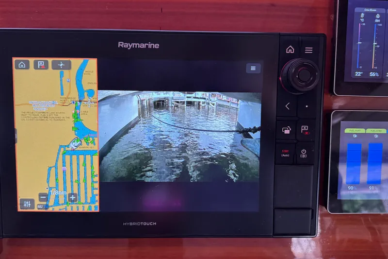 Slide: The Image of Raymarine navigation system on 2011 Sunreef 62 yacht, displaying maps and camera feed. - 25
