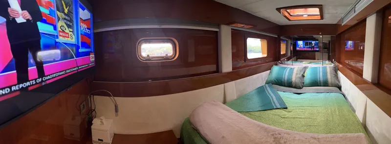 Slide: The Image of Luxurious cabin interior of 2011 Sunreef 62 yacht with TV and cozy bedding. - 28