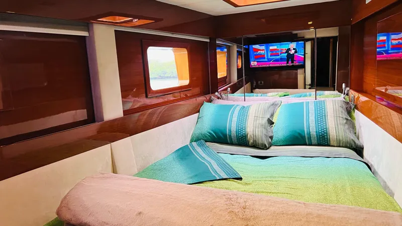 Slide: The Image of Luxurious cabin interior of 2011 Sunreef 62 yacht with cozy bedding and TV. - 29