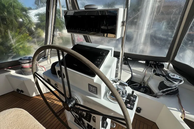 Slide: The Image of Helm of 2011 Sunreef 62 yacht with navigation equipment and steering wheel. - 36