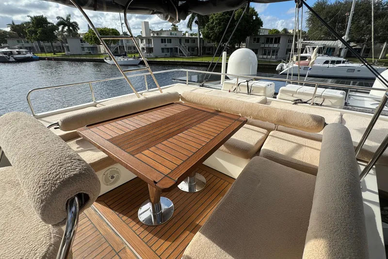 Slide: The Image of Luxurious Sunreef 62 yacht deck with cushioned seating and wooden table, 2011 model. - 41