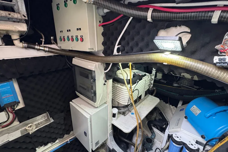 Slide: The Image of Engine room of a 2011 Sunreef 62 yacht with control panels and equipment. - 53