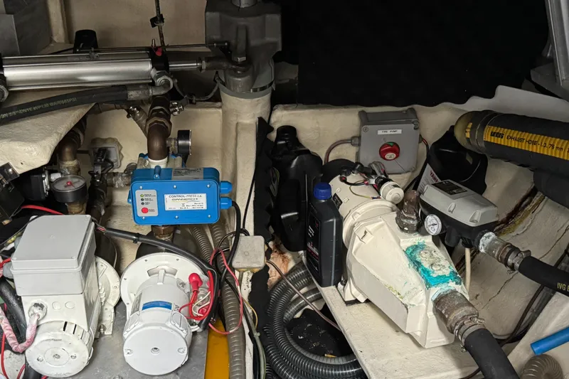 Slide: The Image of Engine room of a 2011 Sunreef 62 yacht with various mechanical components. - 58