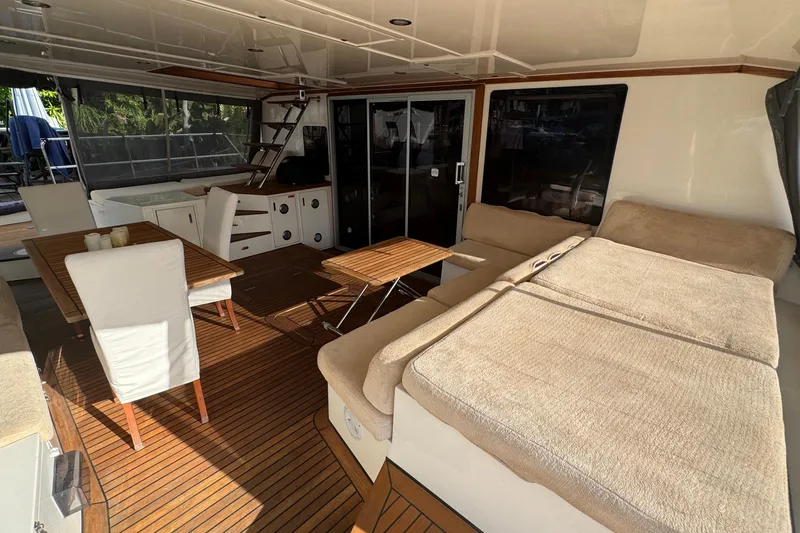 Slide: The Image of Luxurious Sunreef 62 yacht interior, featuring elegant seating and dining area, 2011 model. - 6