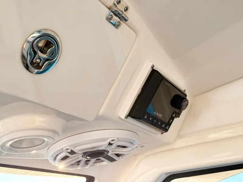 Slide: The Image of 2022 Pursuit DC 365 Dual Console interior with JL Audio system and speaker. - 31