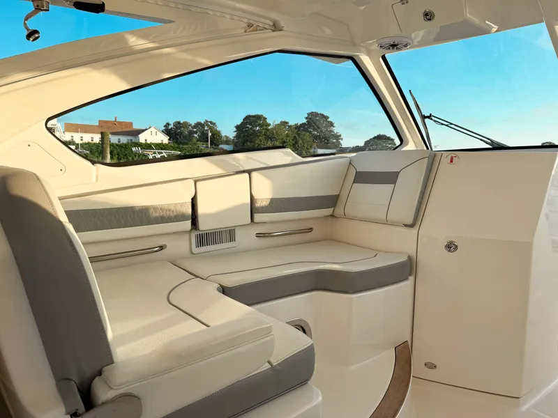 Slide: The Image of 2022 Pursuit DC 365 Dual Console interior with luxurious seating and scenic view. - 35