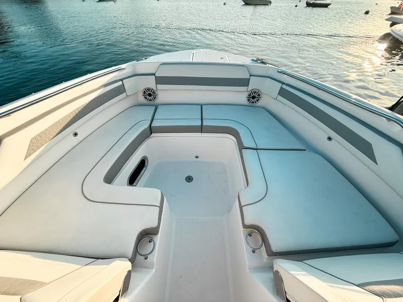 Slide: The Image of 2022 Pursuit DC 365 Dual Console boat interior with spacious seating and ocean view. - 41