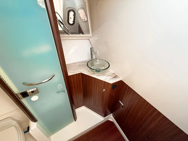 Slide: The Image of Luxurious bathroom interior of 2022 Pursuit DC 365 Dual Console boat. - 49