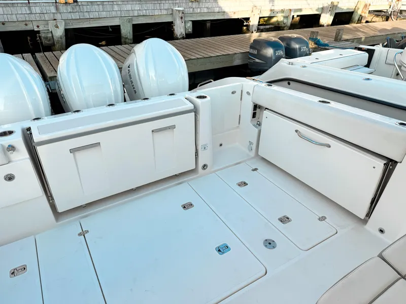 Slide: The Image of 2022 Pursuit DC 365 Dual Console boat with Yamaha engines at dockside. - 8