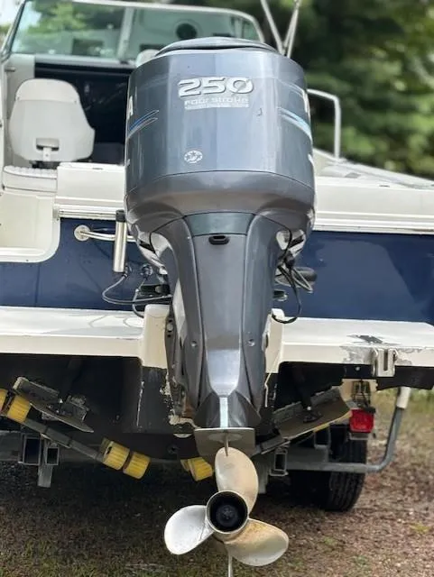 Slide: The Image of 2006 Caravelle Sea Hawk 230 Walk Around with powerful outboard motor. - 2