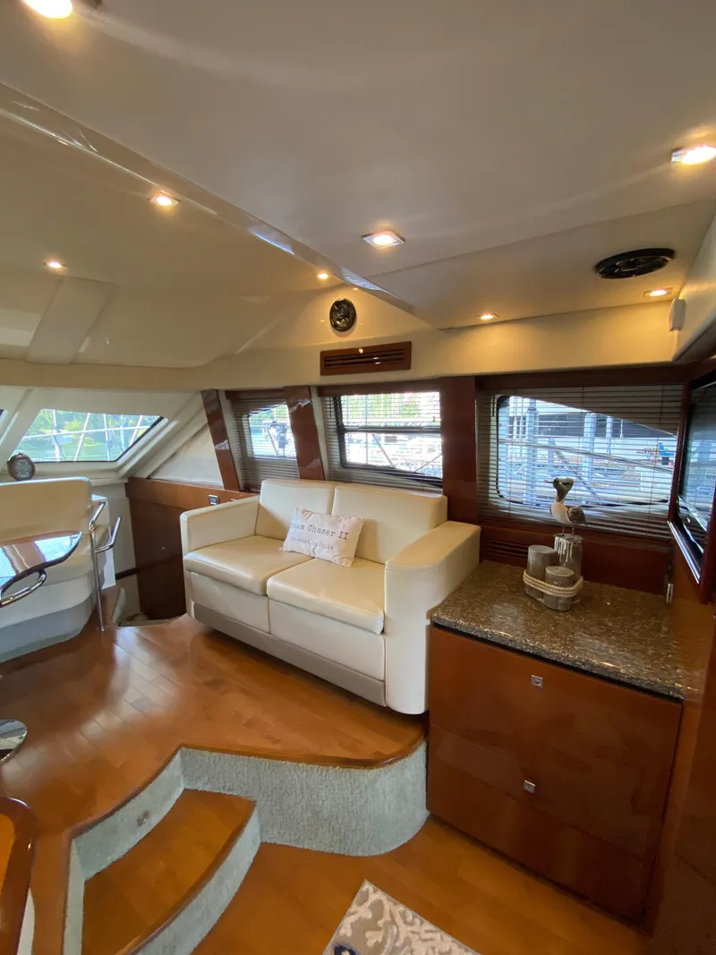 Slide: The Image of Luxurious interior of 2008 Sea Ray 47 Sedan Bridge yacht with elegant seating and wood finishes. - 11
