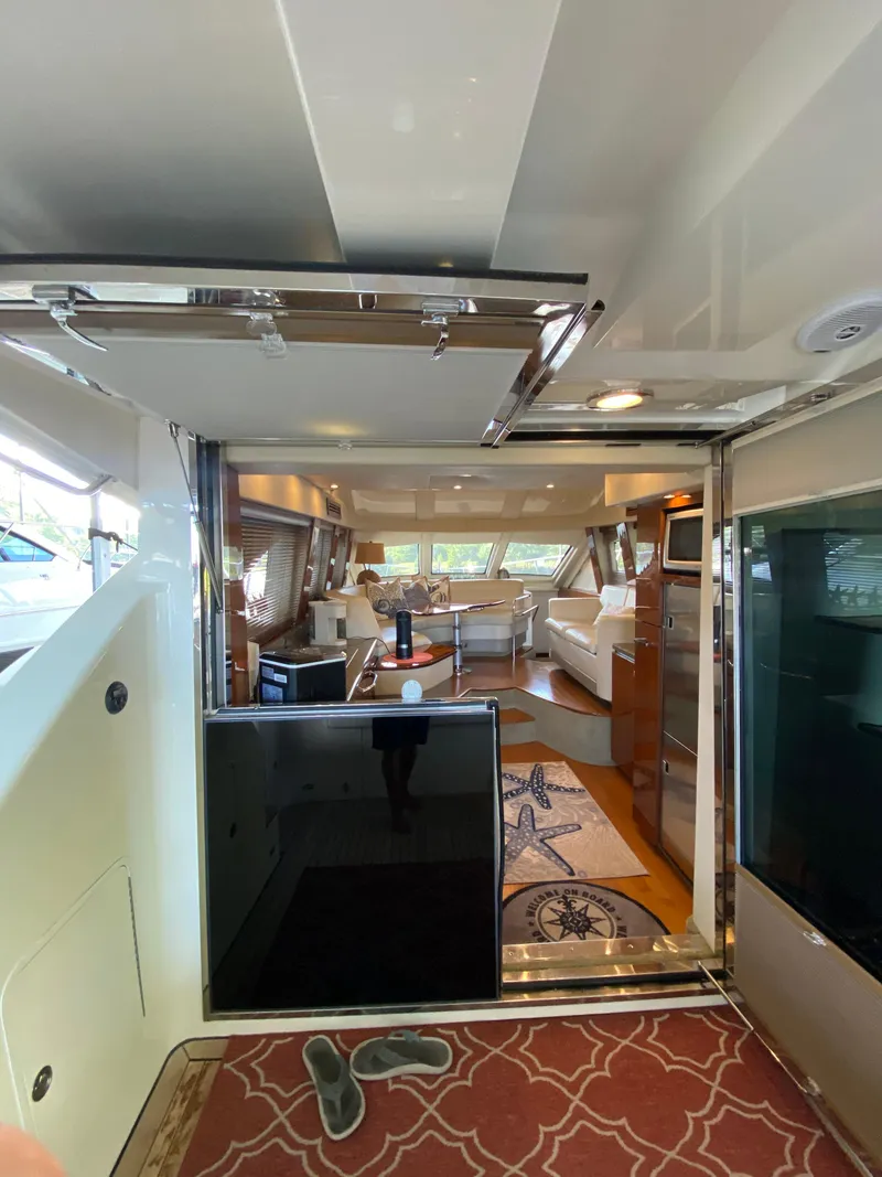 Slide: The Image of Interior view of 2008 Sea Ray 47 Sedan Bridge yacht, featuring luxurious seating and decor. - 15