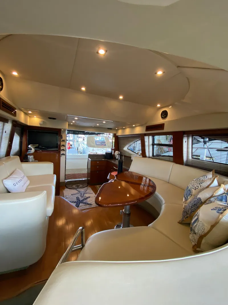 Slide: The Image of Luxurious interior of 2008 Sea Ray 47 Sedan Bridge yacht with elegant seating and decor. - 27
