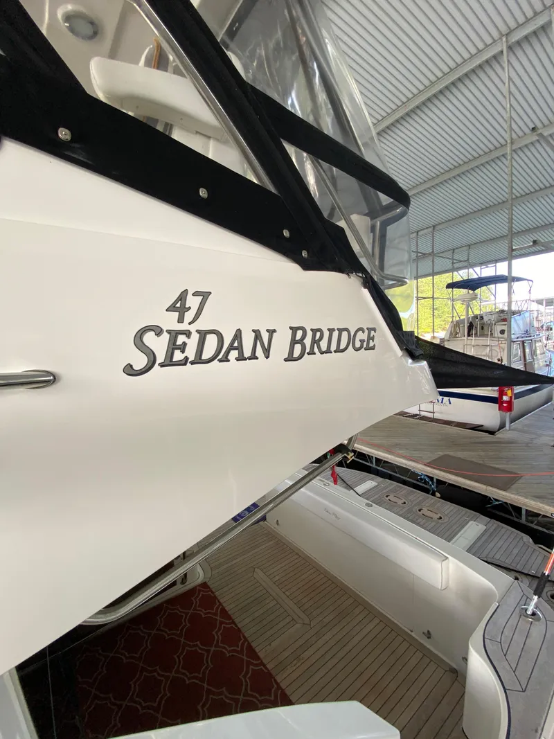 Slide: The Image of 2008 Sea Ray 47 Sedan Bridge yacht docked in a covered marina. - 39