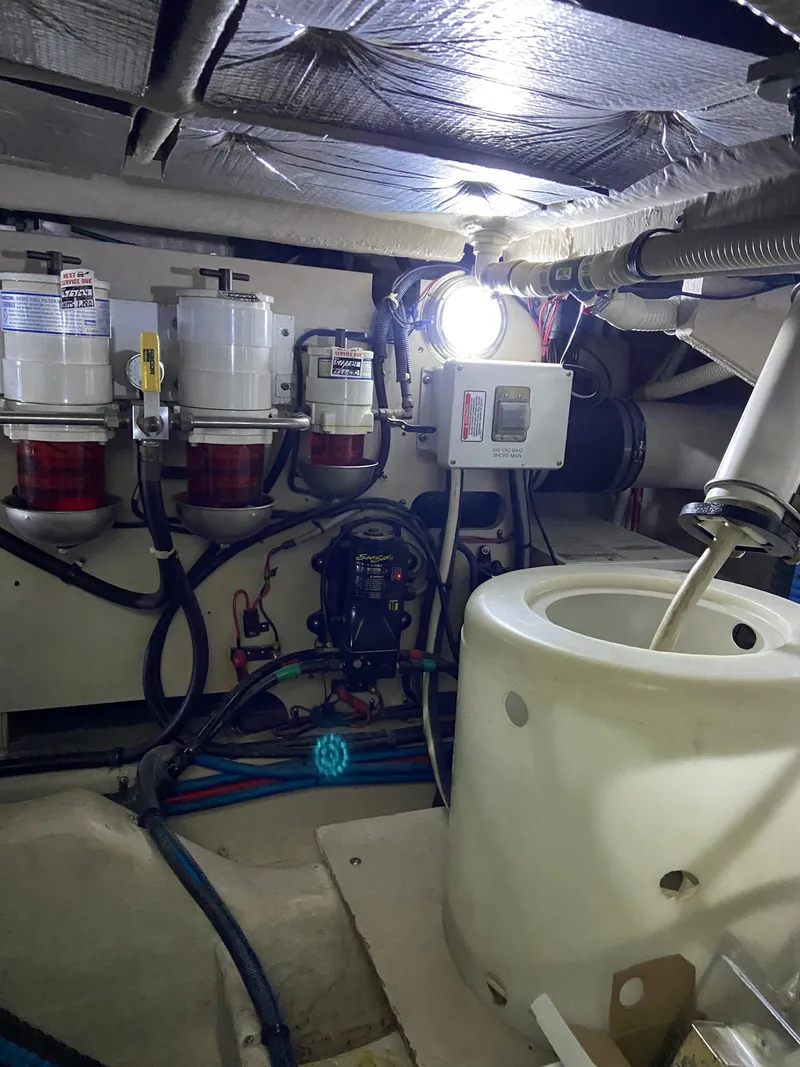 Slide: The Image of Engine room of 2008 Sea Ray 47 Sedan Bridge with fuel filters and equipment. - 41