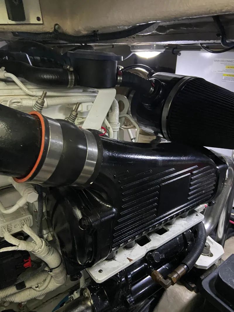 Slide: The Image of Engine compartment of a 2008 Sea Ray 47 Sedan Bridge yacht, showcasing detailed components. - 44