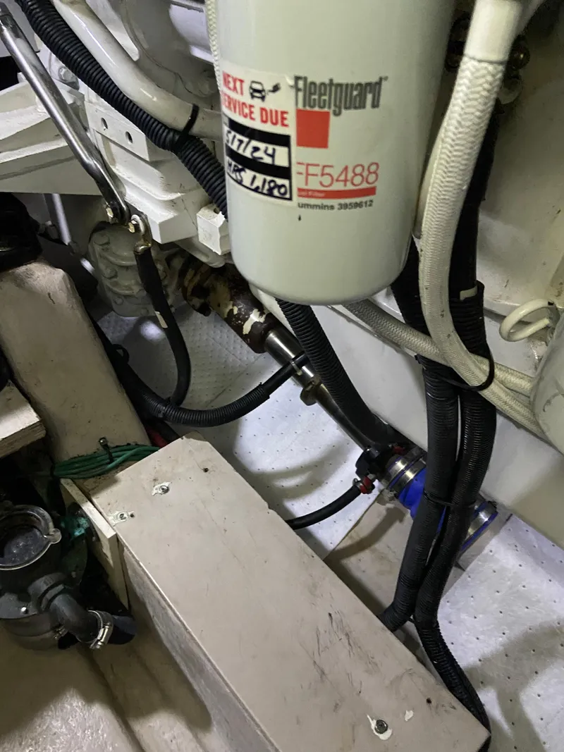 Slide: The Image of Engine room of 2008 Sea Ray 47 Sedan Bridge with Fleetguard filter and hoses. - 45