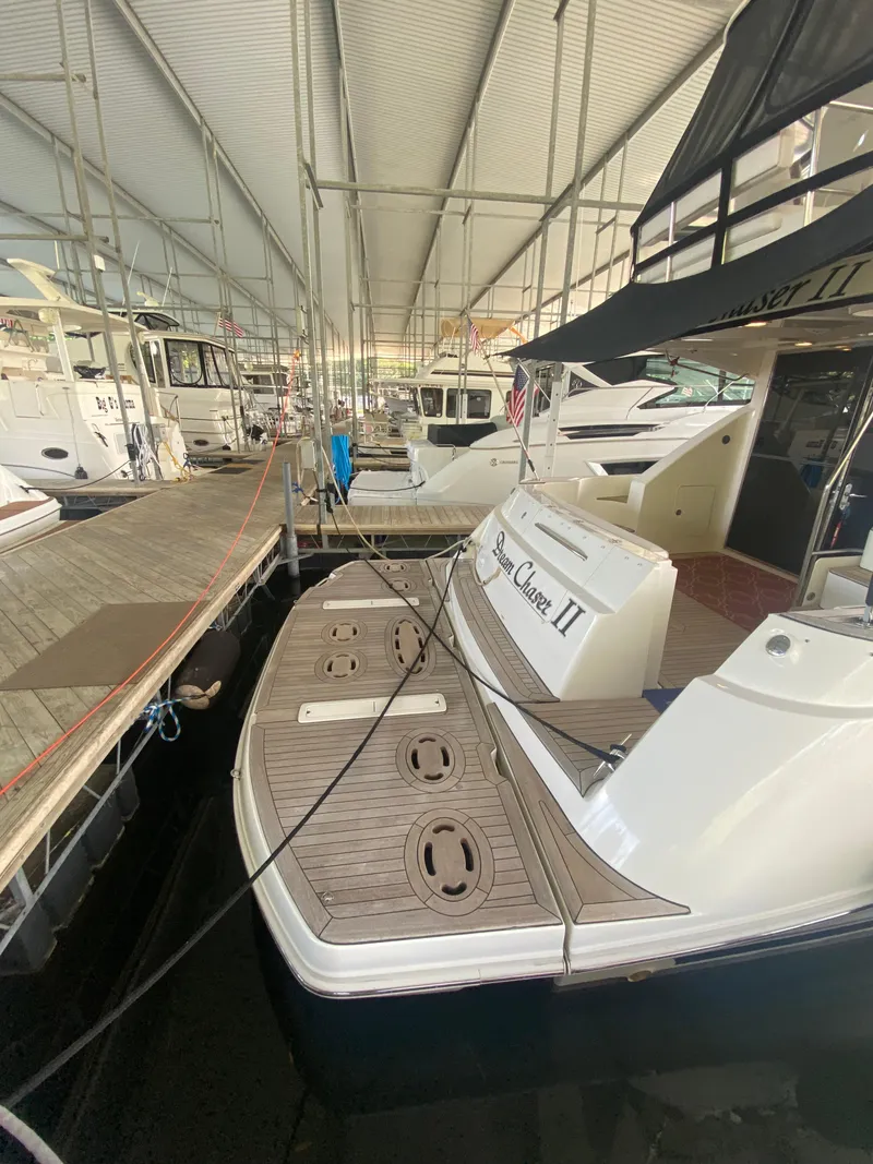 Slide: The Image of 2008 Sea Ray 47 Sedan Bridge docked in a covered marina. - 5
