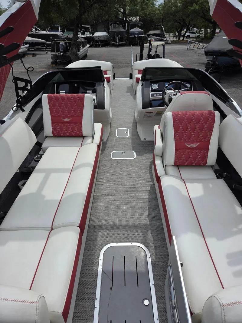 Slide: The Image of 2020 Bennington QX 25 Sport boat interior with red and white seating. - 10
