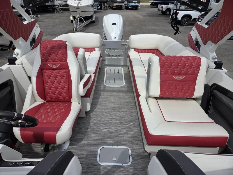 Slide: The Image of 2020 Bennington QX 25 Sport interior with red and white seating, showcasing luxury design. - 11