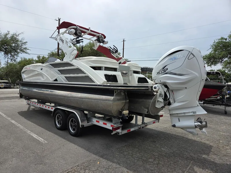 Slide: The Image of 2020 Bennington QX 25 Sport pontoon boat on trailer with Yamaha outboard motor. - 3