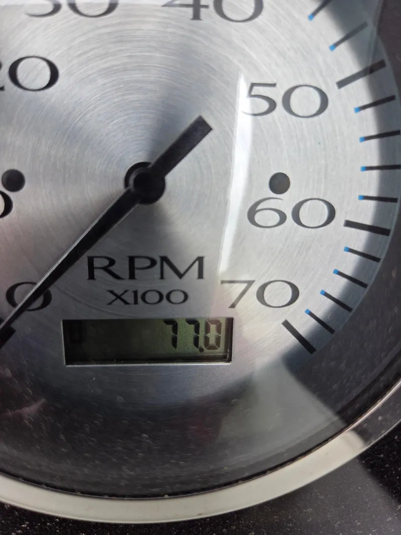 Slide: The Image of Close-up of a Bennington QX 25 Sport tachometer showing 7700 RPM. - 6