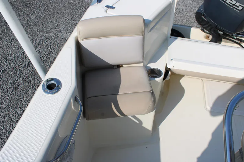 Slide: The Image of 2007 Scout 222 Sportfish boat seat with cup holder and railing. - 14