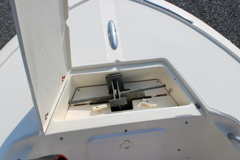 Slide: The Image of Anchor compartment of 2007 Scout 222 Sportfish boat, open with visible anchor. - 17