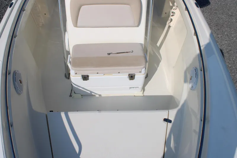 Slide: The Image of 2007 Scout 222 Sportfish boat interior with seating and storage area. - 19