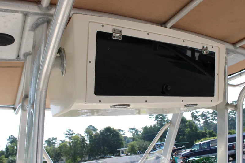 Slide: The Image of 2007 Scout 222 Sportfish boat console with storage compartment and latch. - 21