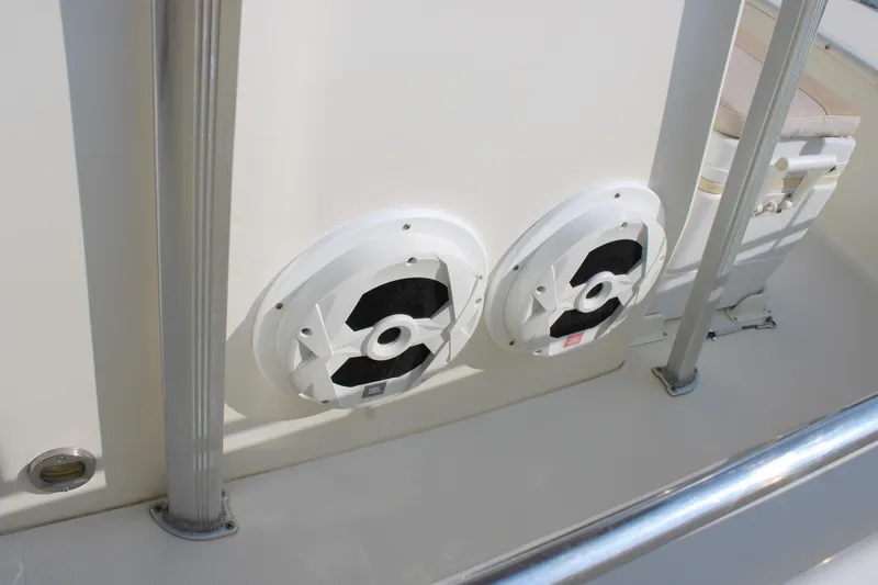 Slide: The Image of Speakers on a 2007 Scout 222 Sportfish boat, featuring white marine audio equipment. - 23