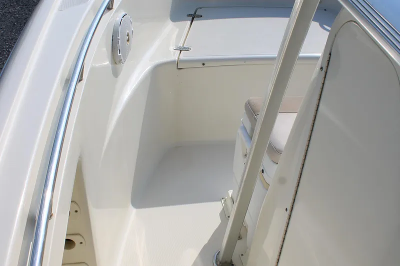 Slide: The Image of 2007 Scout 222 Sportfish boat interior with seating and railing. - 24