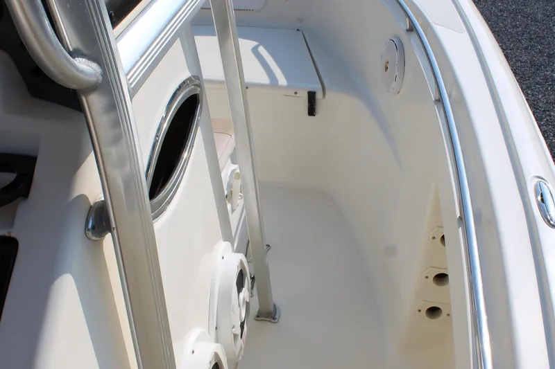 Slide: The Image of 2007 Scout 222 Sportfish boat interior with stainless steel railings and seating area. - 25