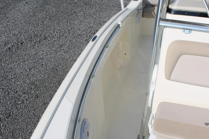 Slide: The Image of 2007 Scout 222 Sportfish boat interior with beige seating and clean deck. - 26