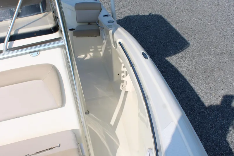 Slide: The Image of 2007 Scout 222 Sportfish boat interior with seating and storage compartments. - 27