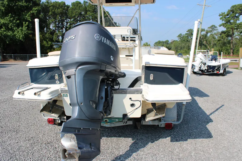 Slide: The Image of 2007 Scout 222 Sportfish boat with Yamaha 225 outboard motor, parked on gravel. - 7