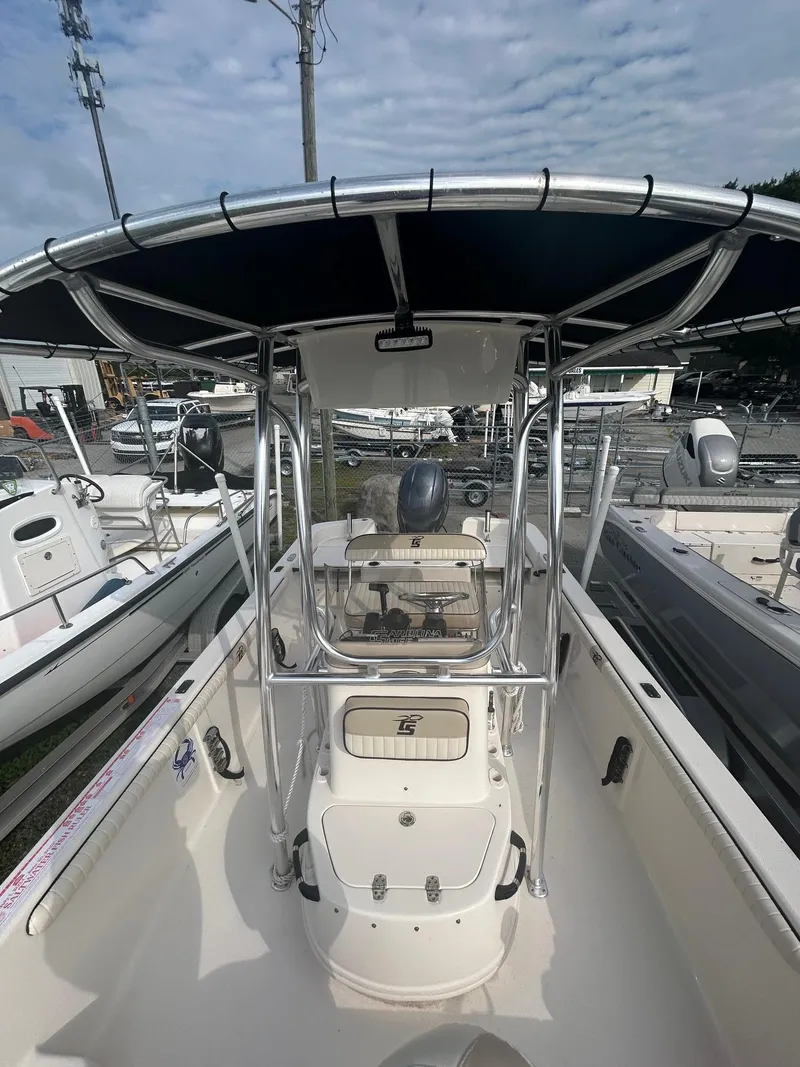 Slide: The Image of 2022 Carolina Skiff 19 LS boat with T-top and center console. - 7