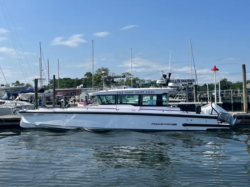 The Image of 2024 Axopar Cross Cabin boat cruising on water, available at East Coast Yacht Sales. - 0