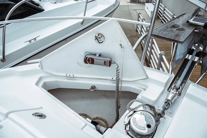 Slide: The Image of 2023 Jeanneau NC 1095 boat anchor compartment with winch and control panel. - 13