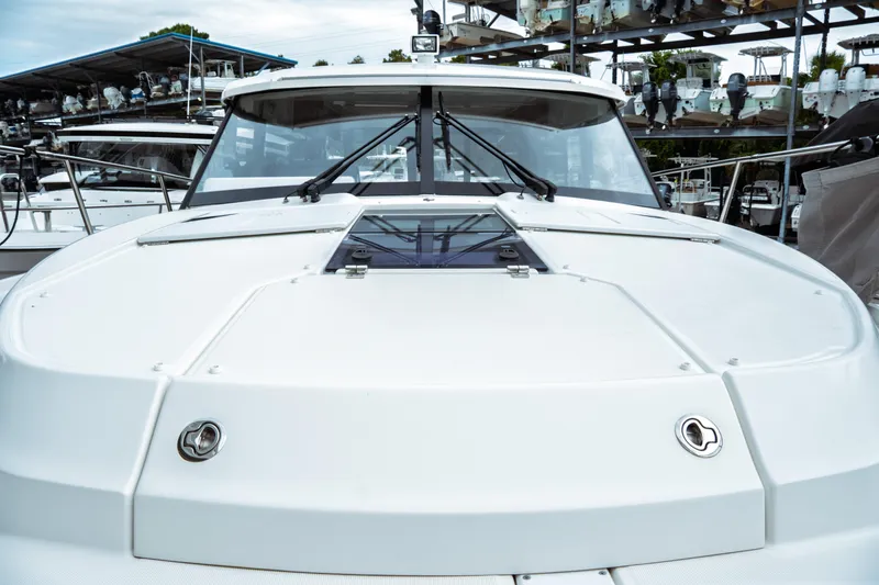 Slide: The Image of 2023 Jeanneau NC 1095 boat, front deck view, docked in marina. - 15