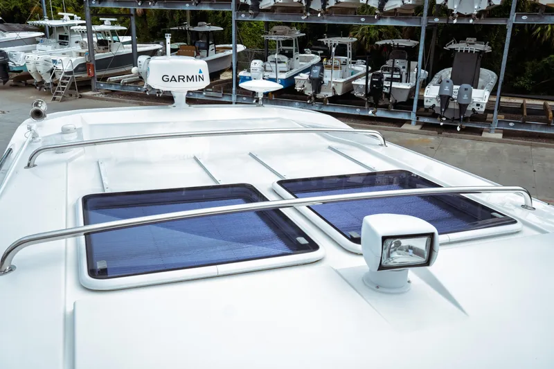 Slide: The Image of 2023 Jeanneau NC 1095 boat roof with solar panels and Garmin radar. - 18
