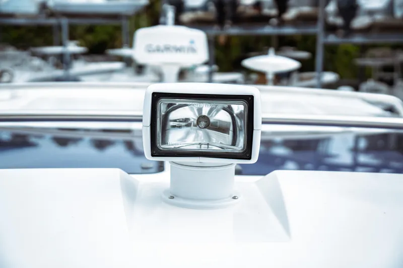Slide: The Image of Close-up of a spotlight on a 2023 Jeanneau NC 1095 boat deck. - 19
