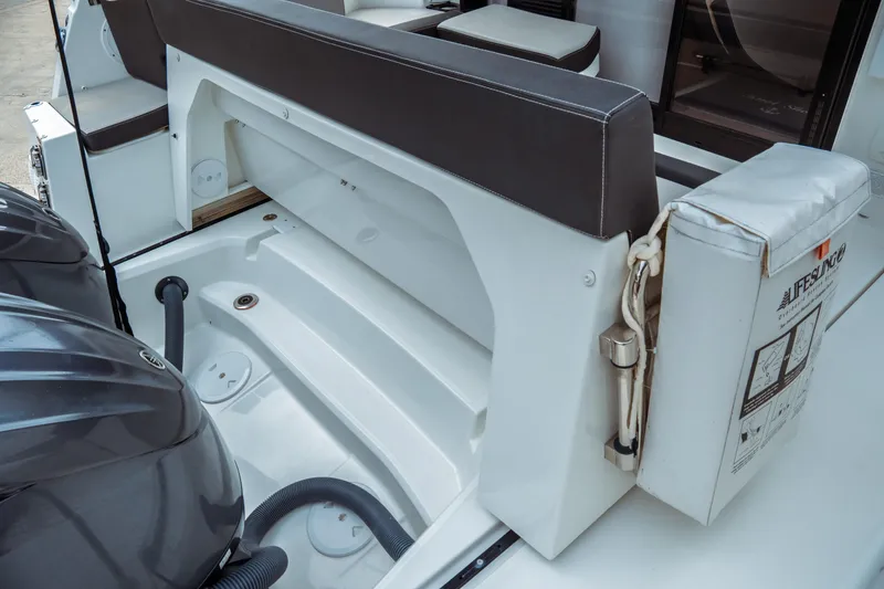 Slide: The Image of 2023 Jeanneau NC 1095 boat stern with seating and outboard engines. - 22